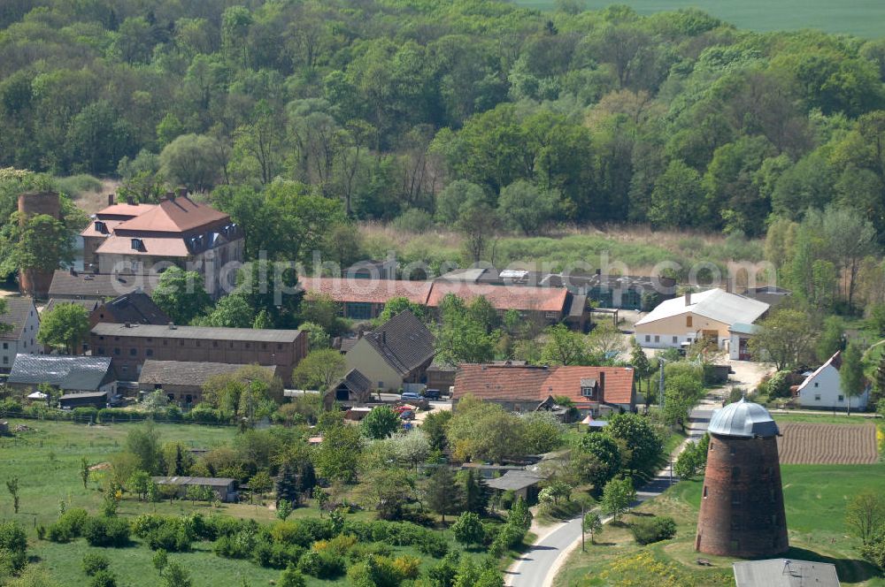 Aerial photograph Zichow - Blick auf die Holländerwindmühle. Sie wurde 1898 erbaut und ist noch im Originalzustand erhalten. Sie ist Zichows Wahrzeichen und steht unter Denkmalschutz. Die Mühle ist begebar und bietet eine gute Aussicht über die Umgebung. Kontakt: Amt Gramzow, Poststr. 25, 17291 Gramzow, Tel. 039861 / 600 10, info@amt-gramzow.de