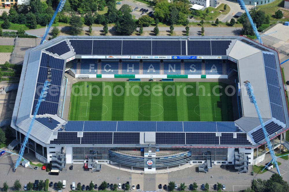 Rostock from the bird's eye view: Die DKB-Arena (von 1954 bis 2007 Ostseestadion) ist ein Fußballstadion in der Hansestadt Rostock, das als Veranstaltungsort insbesondere für Heimspiele des F.C. Hansa Rostock genutzt wird. Die Ostseestadion GmbH & Co. KG mit dem F.C. Hansa Rostock als einzigem Kommanditisten ist Betreiber der DKB-Arena. Im Dezember 2010 wurde auf dem Dach der DKB-Arena eine Solaranlage fertiggestellt, deren Betreiber Paribus northenergy mit dieser rund 600.000 kWh Strom jährlich produzieren will. The DKB-Arena, the stadium is a football stadium in the Hanseatic city of Rostock, as the venue especially for home games of FC Hansa Rostock is used.