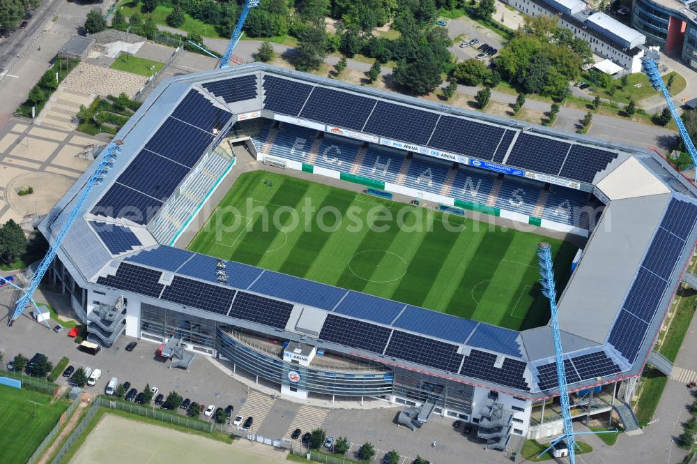 Aerial image Rostock - Die DKB-Arena (von 1954 bis 2007 Ostseestadion) ist ein Fußballstadion in der Hansestadt Rostock, das als Veranstaltungsort insbesondere für Heimspiele des F.C. Hansa Rostock genutzt wird. Die Ostseestadion GmbH & Co. KG mit dem F.C. Hansa Rostock als einzigem Kommanditisten ist Betreiber der DKB-Arena. Im Dezember 2010 wurde auf dem Dach der DKB-Arena eine Solaranlage fertiggestellt, deren Betreiber Paribus northenergy mit dieser rund 600.000 kWh Strom jährlich produzieren will. The DKB-Arena, the stadium is a football stadium in the Hanseatic city of Rostock, as the venue especially for home games of FC Hansa Rostock is used.