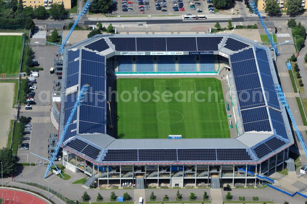 Aerial photograph Rostock - Die DKB-Arena (von 1954 bis 2007 Ostseestadion) ist ein Fußballstadion in der Hansestadt Rostock, das als Veranstaltungsort insbesondere für Heimspiele des F.C. Hansa Rostock genutzt wird. Die Ostseestadion GmbH & Co. KG mit dem F.C. Hansa Rostock als einzigem Kommanditisten ist Betreiber der DKB-Arena. Im Dezember 2010 wurde auf dem Dach der DKB-Arena eine Solaranlage fertiggestellt, deren Betreiber Paribus northenergy mit dieser rund 600.000 kWh Strom jährlich produzieren will. The DKB-Arena, the stadium is a football stadium in the Hanseatic city of Rostock, as the venue especially for home games of FC Hansa Rostock is used.