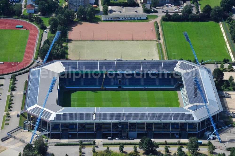 Aerial photograph Rostock - Die DKB-Arena (von 1954 bis 2007 Ostseestadion) ist ein Fußballstadion in der Hansestadt Rostock, das als Veranstaltungsort insbesondere für Heimspiele des F.C. Hansa Rostock genutzt wird. Die Ostseestadion GmbH & Co. KG mit dem F.C. Hansa Rostock als einzigem Kommanditisten ist Betreiber der DKB-Arena. Im Dezember 2010 wurde auf dem Dach der DKB-Arena eine Solaranlage fertiggestellt, deren Betreiber Paribus northenergy mit dieser rund 600.000 kWh Strom jährlich produzieren will. The DKB-Arena, the stadium is a football stadium in the Hanseatic city of Rostock, as the venue especially for home games of FC Hansa Rostock is used.