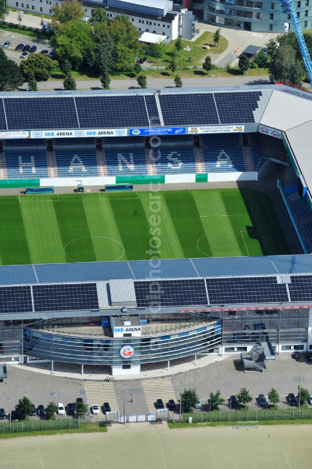 Aerial image Rostock - Die DKB-Arena (von 1954 bis 2007 Ostseestadion) ist ein Fußballstadion in der Hansestadt Rostock, das als Veranstaltungsort insbesondere für Heimspiele des F.C. Hansa Rostock genutzt wird. Die Ostseestadion GmbH & Co. KG mit dem F.C. Hansa Rostock als einzigem Kommanditisten ist Betreiber der DKB-Arena. Im Dezember 2010 wurde auf dem Dach der DKB-Arena eine Solaranlage fertiggestellt, deren Betreiber Paribus northenergy mit dieser rund 600.000 kWh Strom jährlich produzieren will. The DKB-Arena, the stadium is a football stadium in the Hanseatic city of Rostock, as the venue especially for home games of FC Hansa Rostock is used.