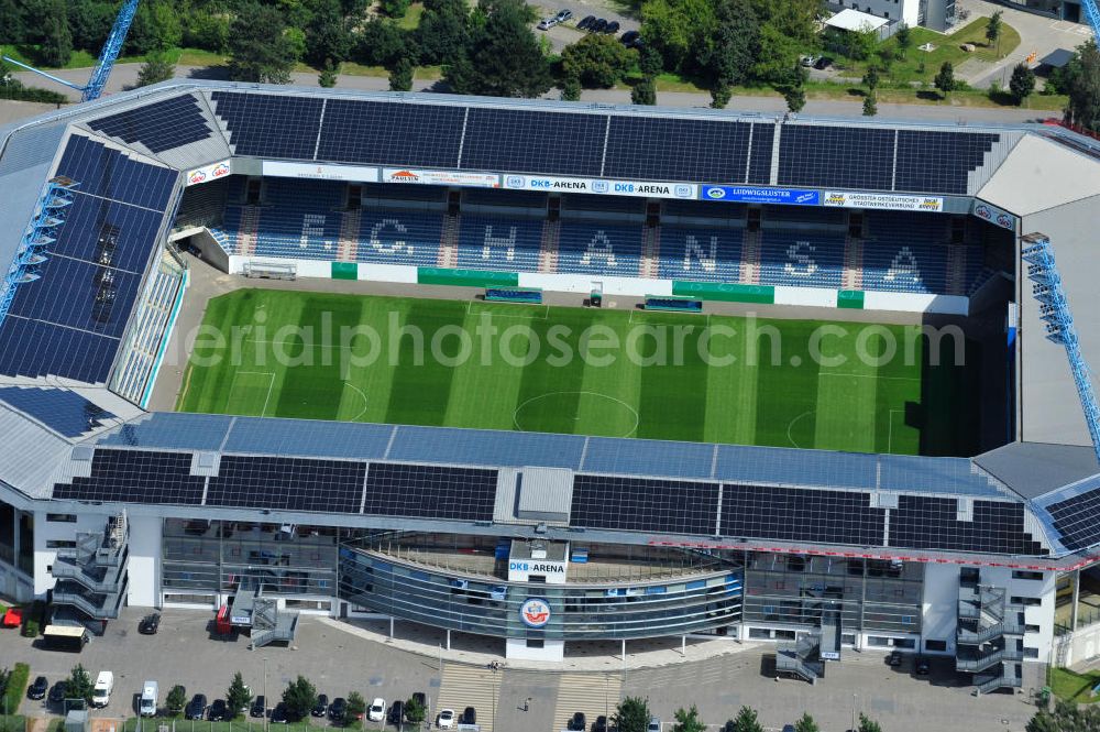 Aerial photograph Rostock - Die DKB-Arena (von 1954 bis 2007 Ostseestadion) ist ein Fußballstadion in der Hansestadt Rostock, das als Veranstaltungsort insbesondere für Heimspiele des F.C. Hansa Rostock genutzt wird. Die Ostseestadion GmbH & Co. KG mit dem F.C. Hansa Rostock als einzigem Kommanditisten ist Betreiber der DKB-Arena. Im Dezember 2010 wurde auf dem Dach der DKB-Arena eine Solaranlage fertiggestellt, deren Betreiber Paribus northenergy mit dieser rund 600.000 kWh Strom jährlich produzieren will. The DKB-Arena, the stadium is a football stadium in the Hanseatic city of Rostock, as the venue especially for home games of FC Hansa Rostock is used.