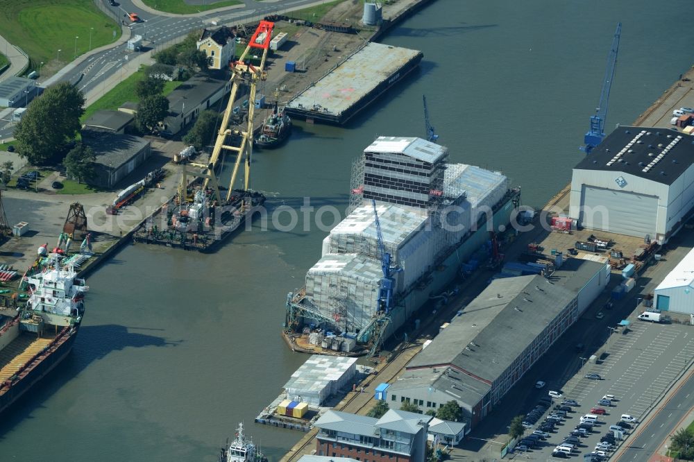 Bremerhaven from above - Dock 6 of the German Dry Docks in Bremerhaven in the state of Bremen. The docks with their production facilities are being run by Rickmers-Lloyd docks and the MWB motor works Bremerhaven