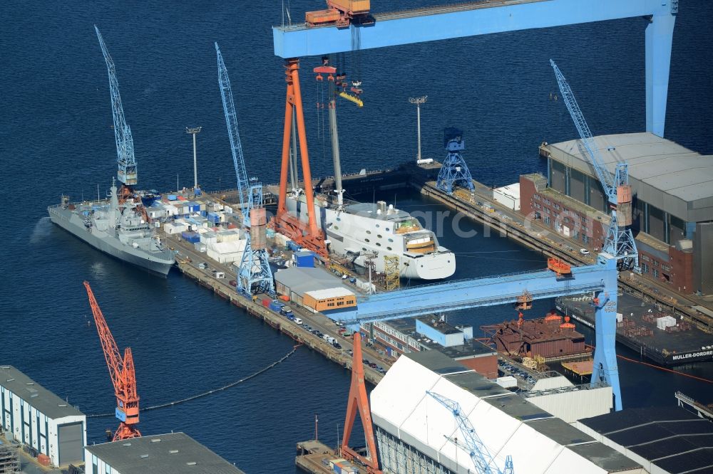 Kiel from above - Dock 8 of the ThyssenKrupp Marine Systems GmbH company in Kiel in the state of Schleswig-Holstein. The site with the blue cranes is primarily used for the production of submarines