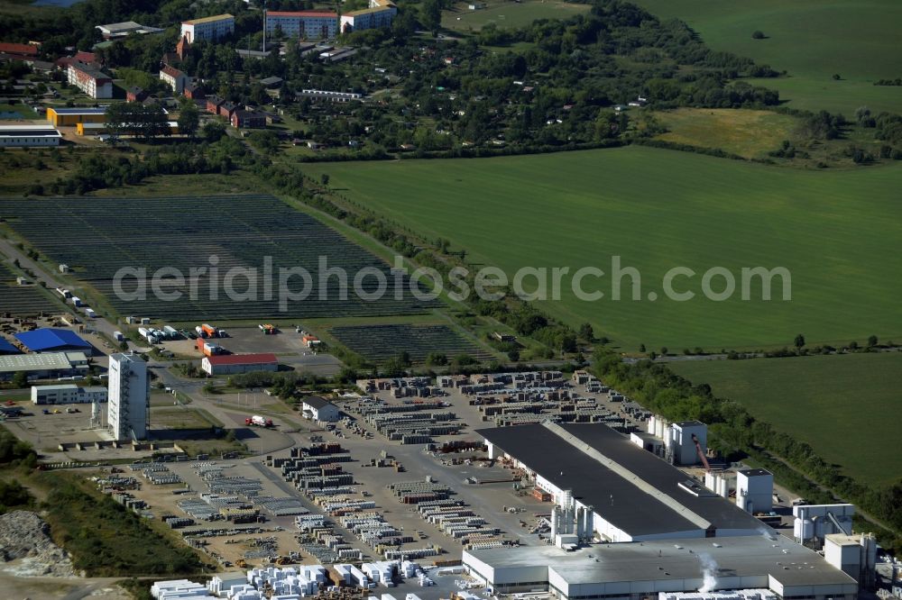 Hohen Wangelin from above - Building material works, solar plant and view of the borough of Hohen Wangelin in the state of Mecklenburg - Western Pomerania. The borough is located in the county district of Mecklenburgische Seenplatte. The works are located in the North of the borough