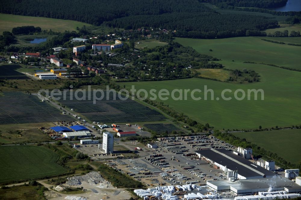 Aerial image Hohen Wangelin - Building material works, solar plant and view of the borough of Hohen Wangelin in the state of Mecklenburg - Western Pomerania. The borough is located in the county district of Mecklenburgische Seenplatte. The works are located in the North of the borough