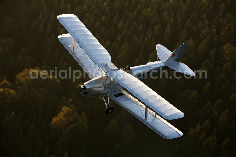 Mengen from above - Double Decker / trainer aircraft / aircraft type De Havilland DH82 Tiger Moth near the airport in amounts in the state of Baden-Wuerttemberg