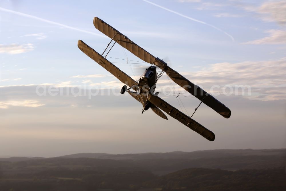 Mengen from the bird's eye view: Double Decker / trainer aircraft / aircraft type De Havilland DH82 Tiger Moth near the airport in amounts in the state of Baden-Wuerttemberg