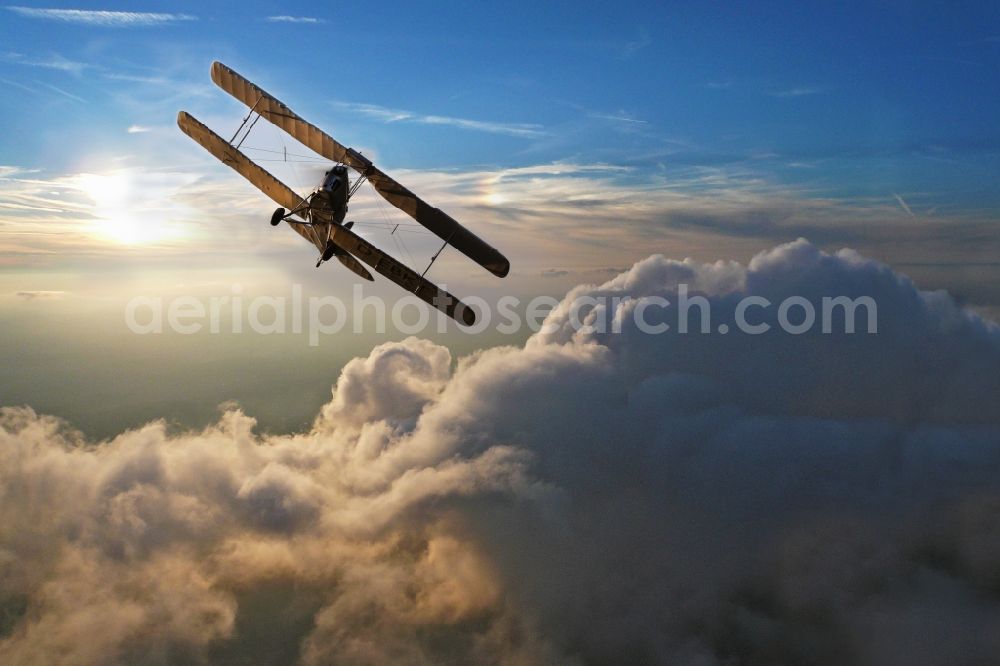 Mengen from the bird's eye view: Double Decker / trainer aircraft / aircraft type De Havilland DH82 Tiger Moth near the airport in amounts in the state of Baden-Wuerttemberg