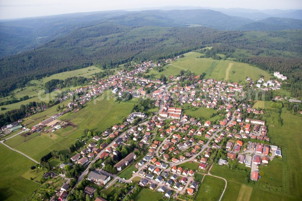 Dobel from the bird's eye view: Village - view on the edge of agricultural fields and farmland in Dobel in the state Baden-Wuerttemberg