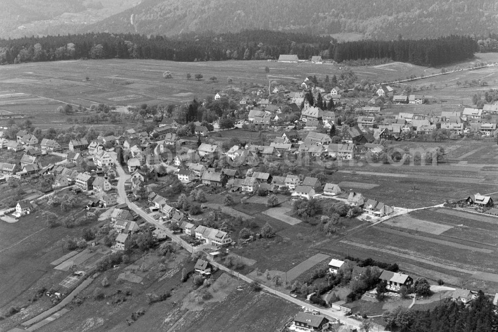 Dobel from the bird's eye view: Village - view on the edge of agricultural fields and farmland in Dobel in northern Black Forest in the state Baden-Wuerttemberg