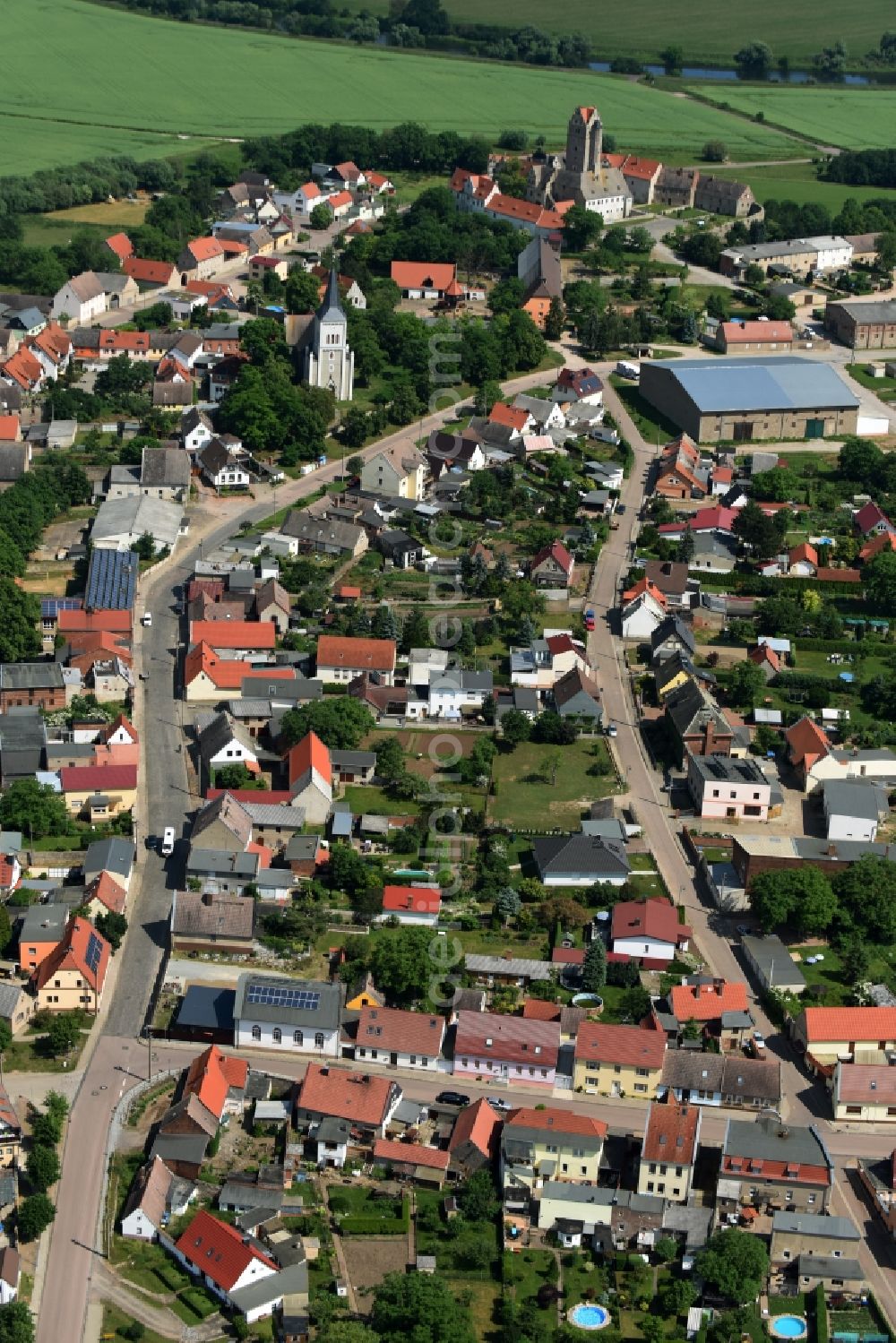 Aerial image Plötzkau - Village view of Ploetzkau with the streets Schlossstrasse and Roehrstrang in the town center in the state Saxony-Anhalt