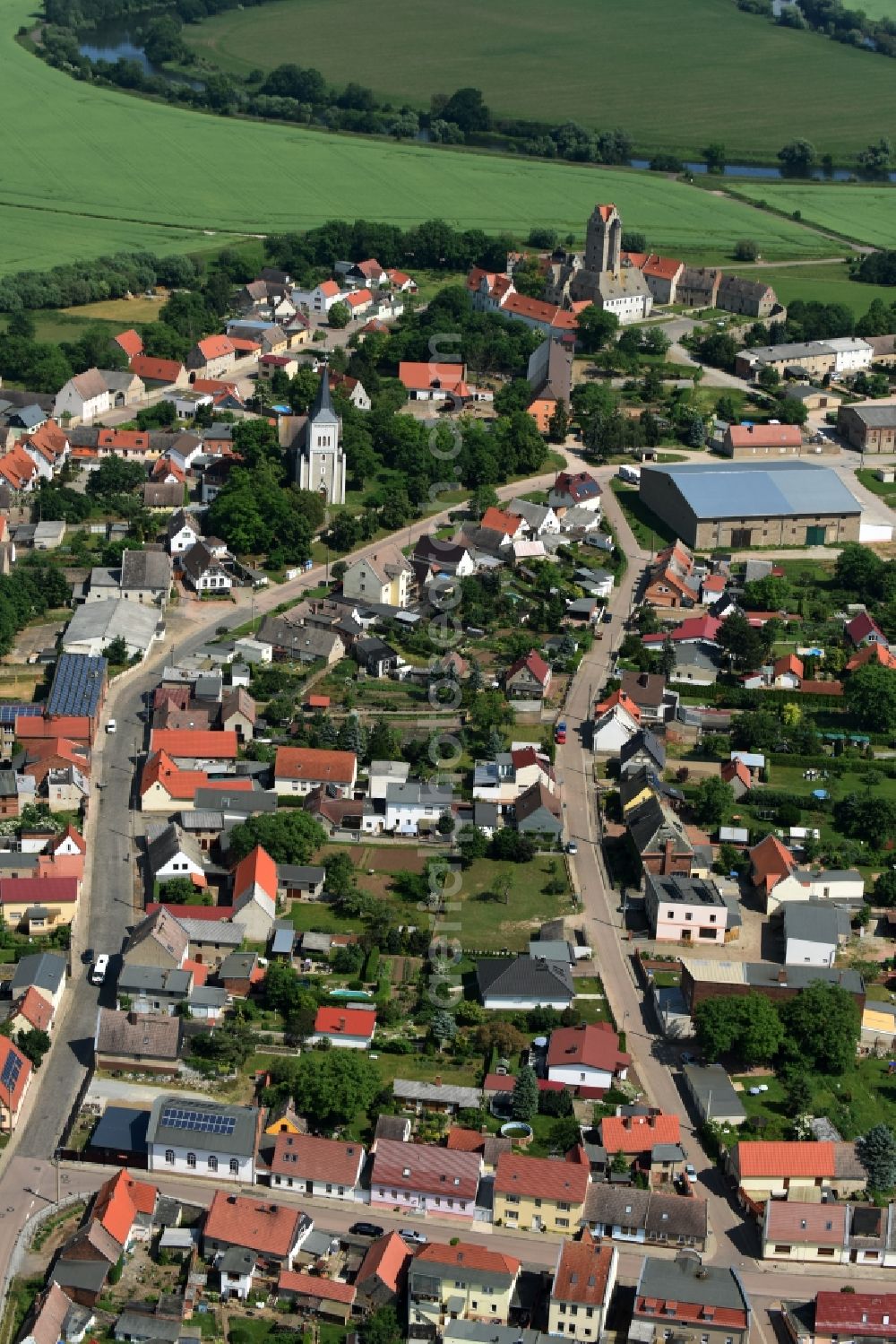 Plötzkau from above - Village view of Ploetzkau with the streets Schlossstrasse and Roehrstrang in the town center in the state Saxony-Anhalt