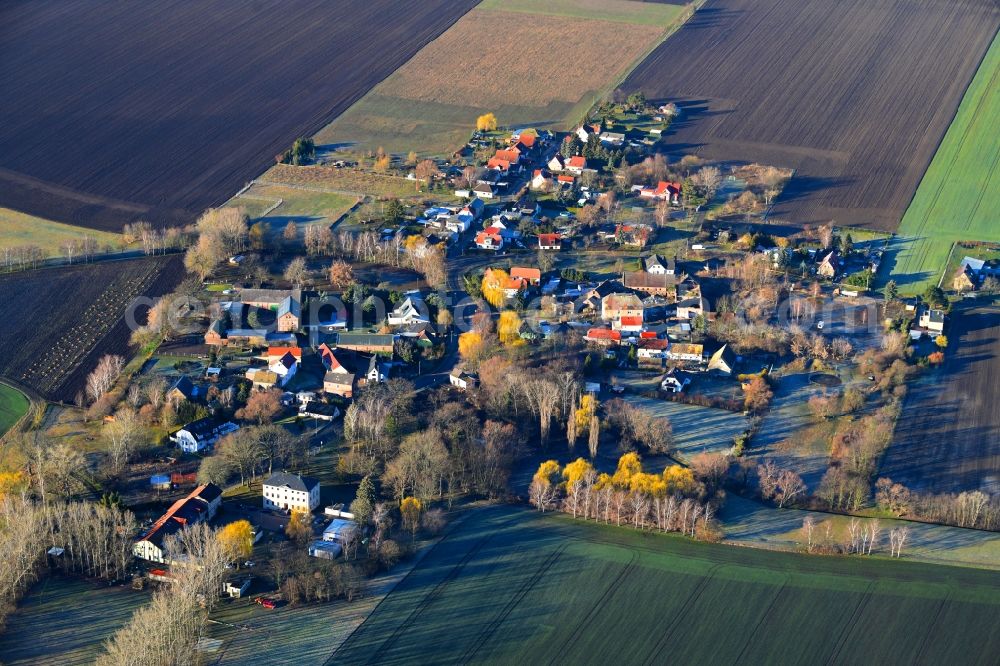 Döhlen from the bird's eye view: Village - view on the edge of agricultural fields and farmland in Doehlen in the state Saxony, Germany