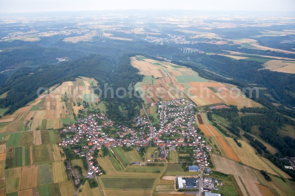 Donsieders from the bird's eye view: Village - view on the edge of agricultural fields and farmland in Donsieders in the state Rhineland-Palatinate