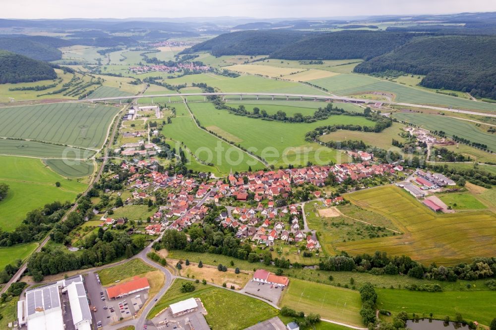 Einhausen from the bird's eye view: Village - view on the edge of agricultural fields and farmland in Einhausen in the state Thuringia, Germany