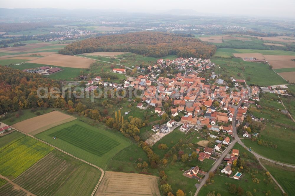 Engwiller from the bird's eye view: Village - view on the edge of agricultural fields and farmland in Engwiller in Grand Est, France