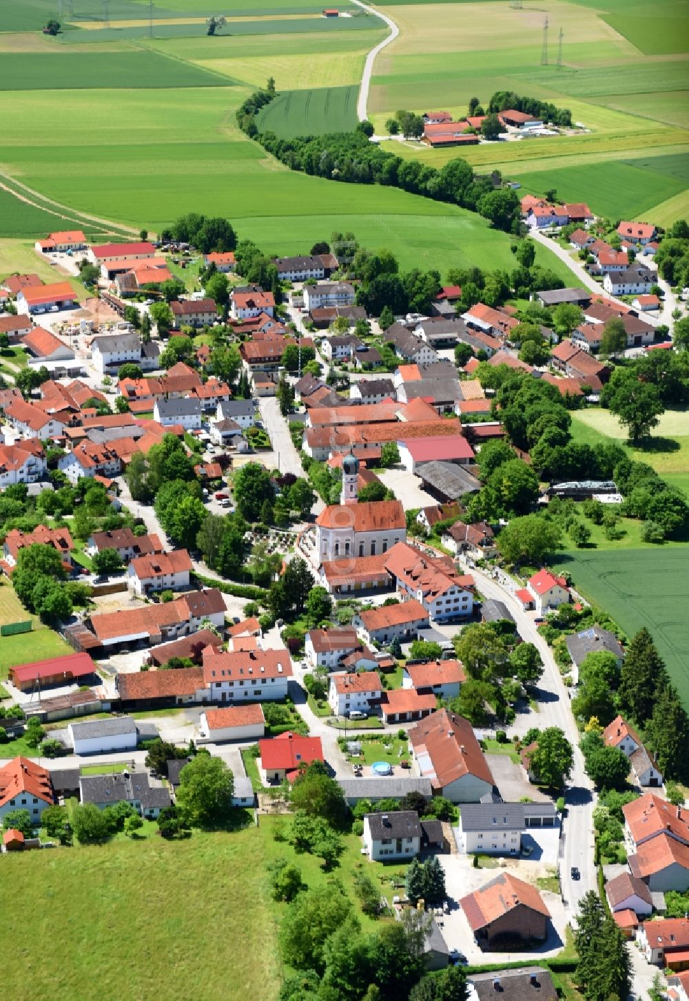 Finsing from the bird's eye view: Village - view on the edge of agricultural fields and farmland in Finsing in the state Bavaria, Germany