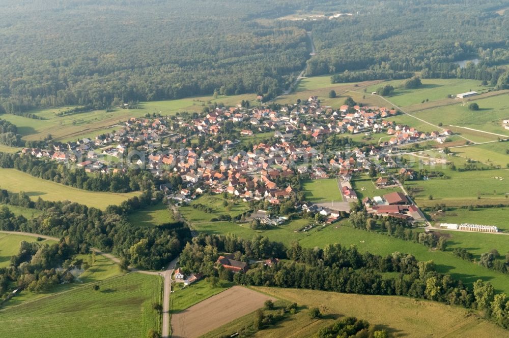 Forstfeld from the bird's eye view: Village - view on the edge of agricultural fields and farmland in Forstfeld in Grand Est, France