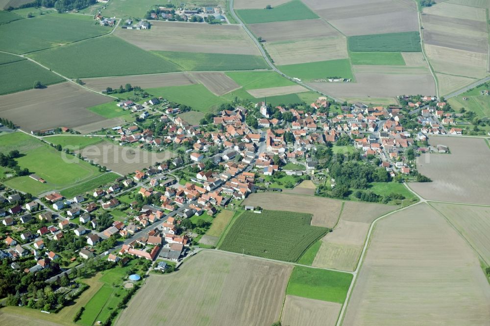 Aerial image Goßmannsdorf - Village - view on the edge of agricultural fields and farmland in Gossmannsdorf in the state Bavaria, Germany