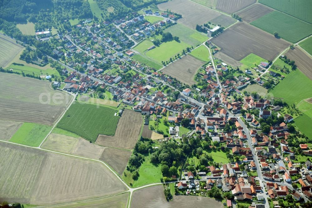 Aerial image Goßmannsdorf - Village - view on the edge of agricultural fields and farmland in Gossmannsdorf in the state Bavaria, Germany