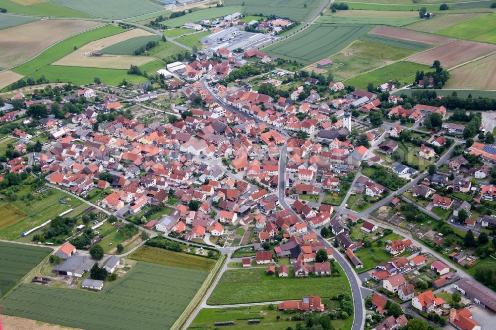 Großbardorf from the bird's eye view: Village - view on the edge of agricultural fields and farmland in Grossbardorf in the state Bavaria, Germany