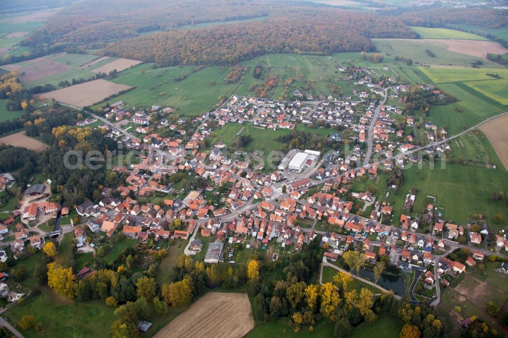 Gumbrechtshoffen from above - Village - view on the edge of agricultural fields and farmland in Gumbrechtshoffen in Grand Est, France