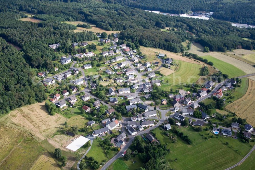 Hattgenstein from above - Village - view on the edge of agricultural fields and farmland in Hattgenstein in the state Rhineland-Palatinate, Germany