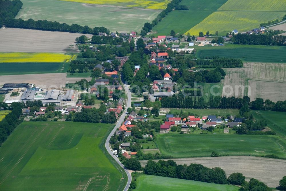 Herzfeld from the bird's eye view: Village - view on the edge of agricultural fields and farmland in Herzfeld in the state Mecklenburg - Western Pomerania, Germany