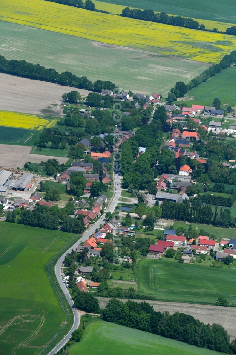 Herzfeld from above - Village - view on the edge of agricultural fields and farmland in Herzfeld in the state Mecklenburg - Western Pomerania, Germany