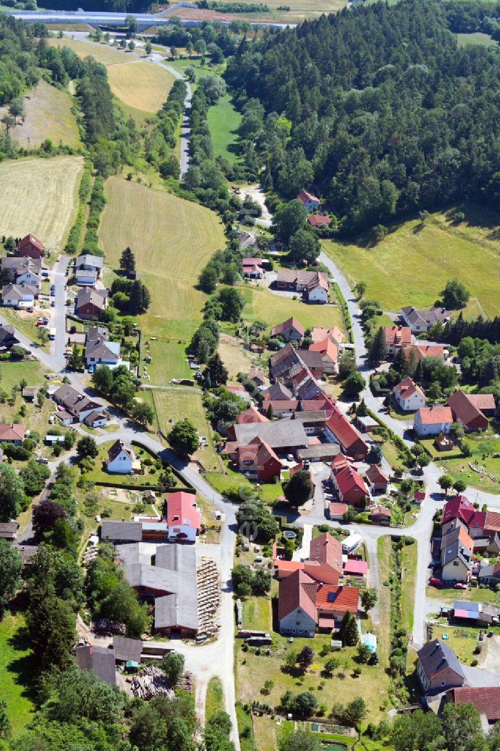 Hollstein from the bird's eye view: Village - view on the edge of agricultural fields and farmland in Hollstein in the state Hesse, Germany