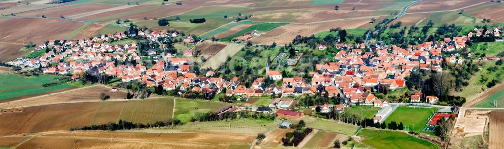 Hunspach from above - Village - view on the edge of agricultural fields and farmland in Hunspach in Grand Est, France