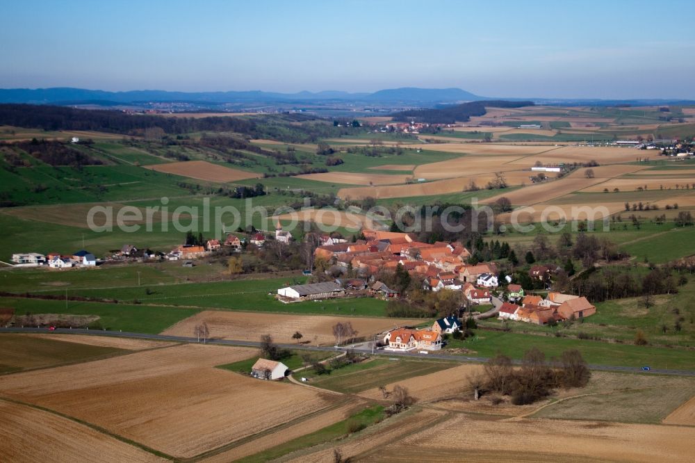 Aerial image Issenhausen - Village - view on the edge of agricultural fields and farmland in Issenhausen in Grand Est, France