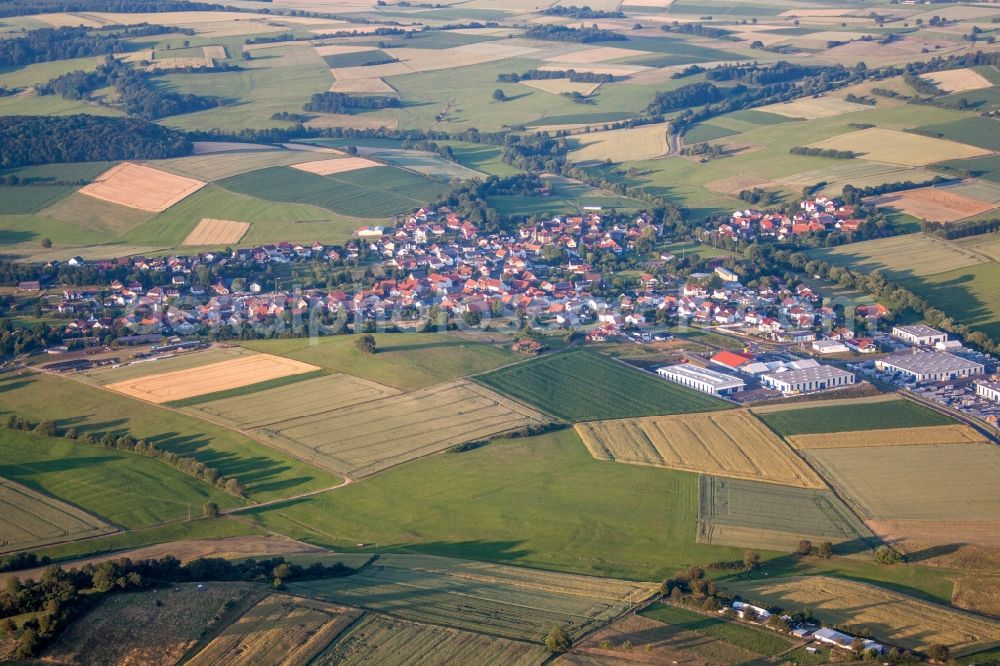 Kefenrod from the bird's eye view: Village - view on the edge of agricultural fields and farmland in Kefenrod in the state Hesse, Germany