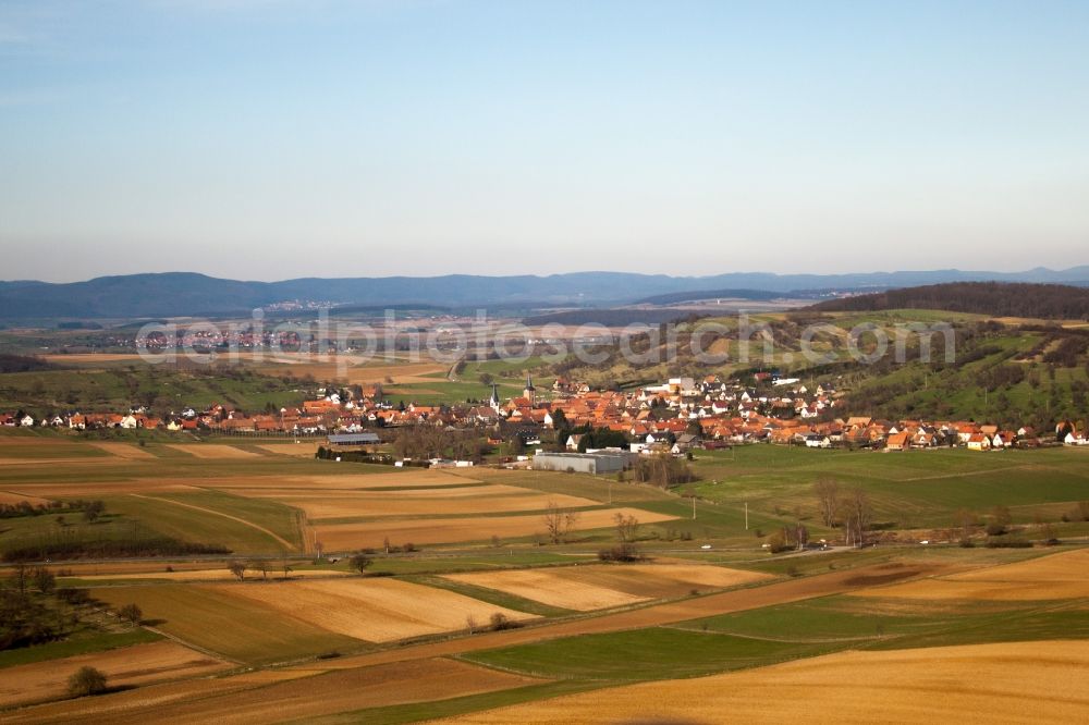 Kirrwiller from above - Village - view on the edge of agricultural fields and farmland in Kirrwiller in Grand Est, France