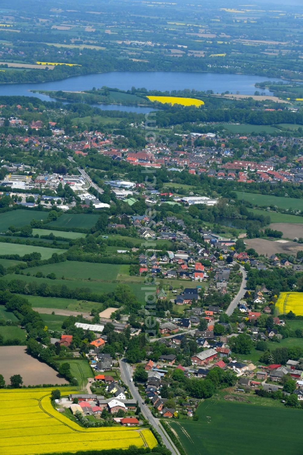 Aerial image Klein Gladebrügge - Village - view on the edge of agricultural fields and farmland in Klein Gladebruegge in the state Schleswig-Holstein, Germany