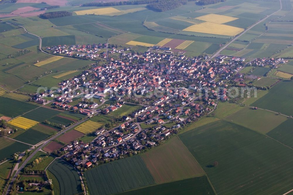 Kleinrinderfeld from the bird's eye view: Village - view on the edge of agricultural fields and farmland in Kleinrinderfeld in the state Bavaria, Germany