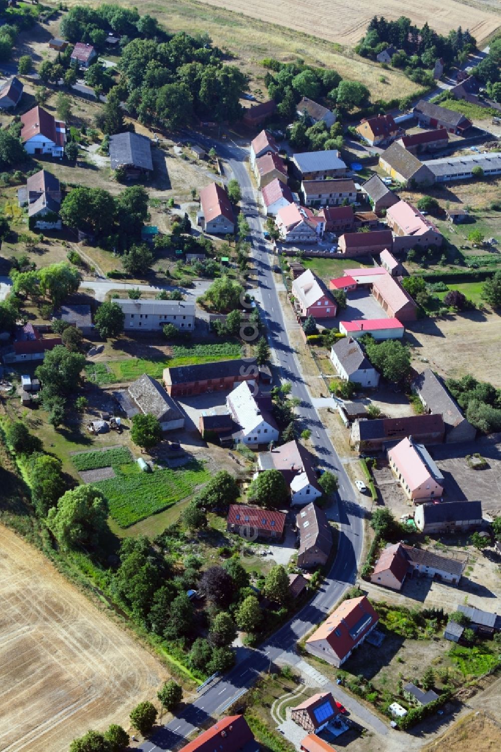 Landin from the bird's eye view: Village - view on the edge of agricultural fields and farmland in Landin in the state Brandenburg, Germany