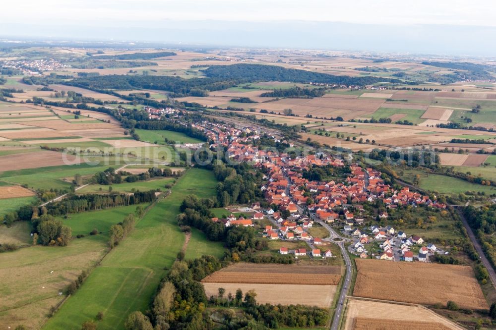 Aerial image Menchhoffen - Village - view on the edge of agricultural fields and farmland in Menchhoffen in Grand Est, France