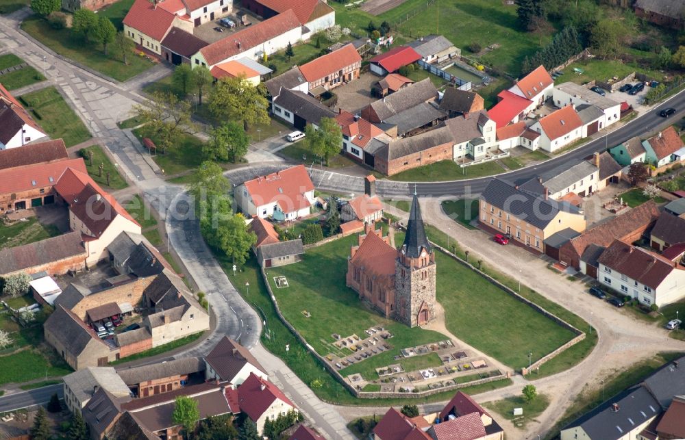 Mühlenfließ from the bird's eye view: Village - view on the edge of agricultural fields and farmland in Nichel in the state Brandenburg, Germany