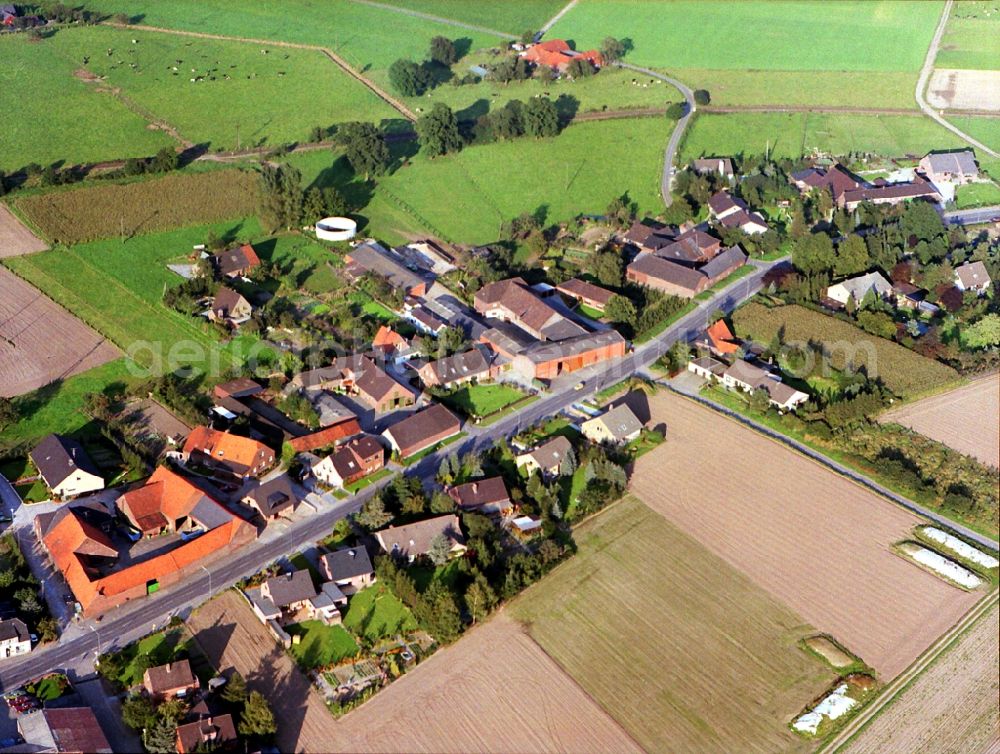 Aerial image Oermten - Village - view on the edge of agricultural fields and farmland in Oermten in the state North Rhine-Westphalia