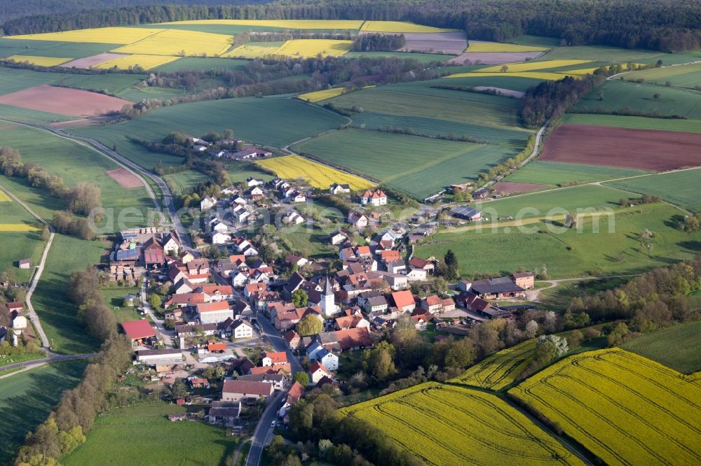 Aerial image Rauhenebrach - Village - view on the edge of agricultural fields and farmland in the district Falsbrunn in Rauhenebrach in the state Bavaria, Germany