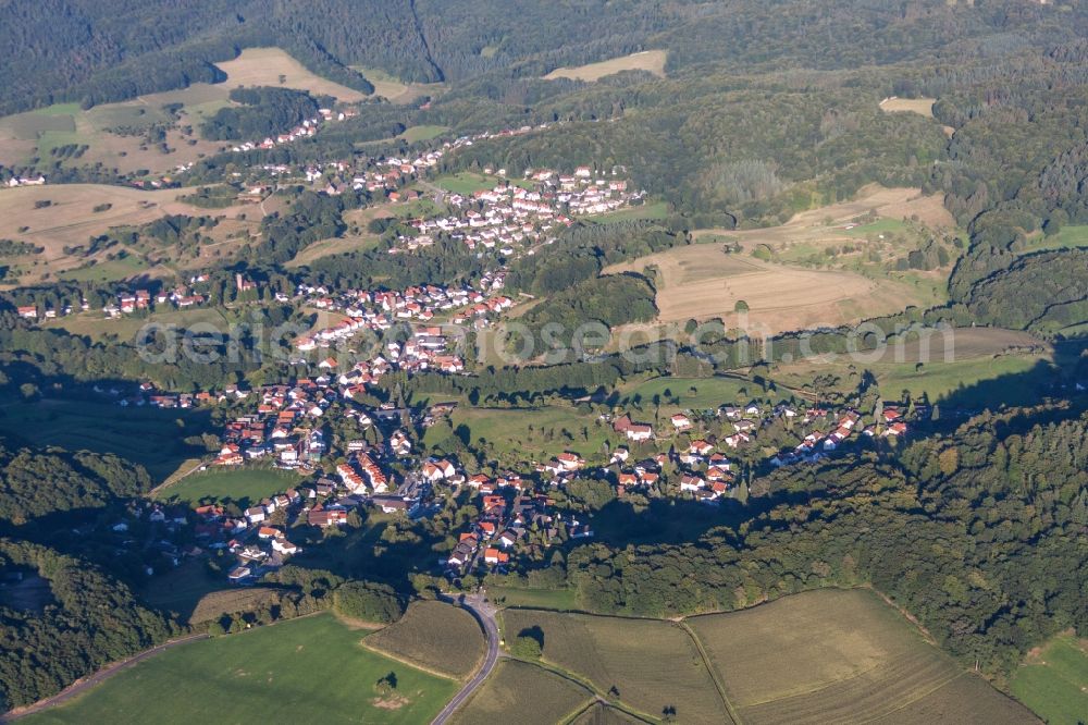 Weinheim from the bird's eye view: Village - view on the edge of agricultural fields and farmland in the district Oberflockenbach in Weinheim in the state Baden-Wuerttemberg, Germany