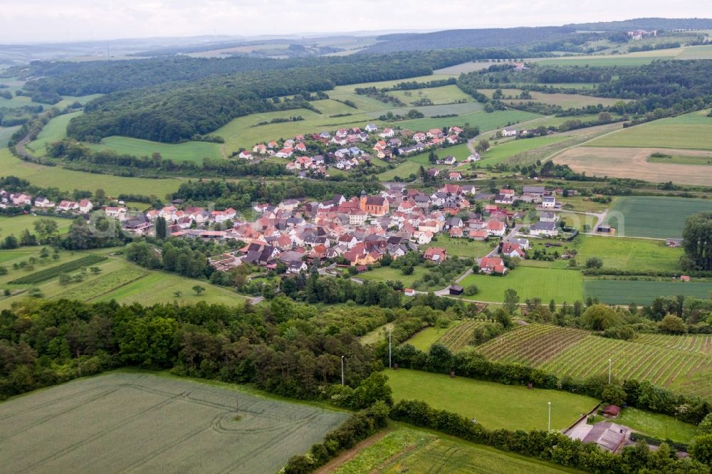 Aerial image Arnstein - Village - view on the edge of agricultural fields and farmland in the district Reuchelheim in Arnstein in the state Bavaria, Germany