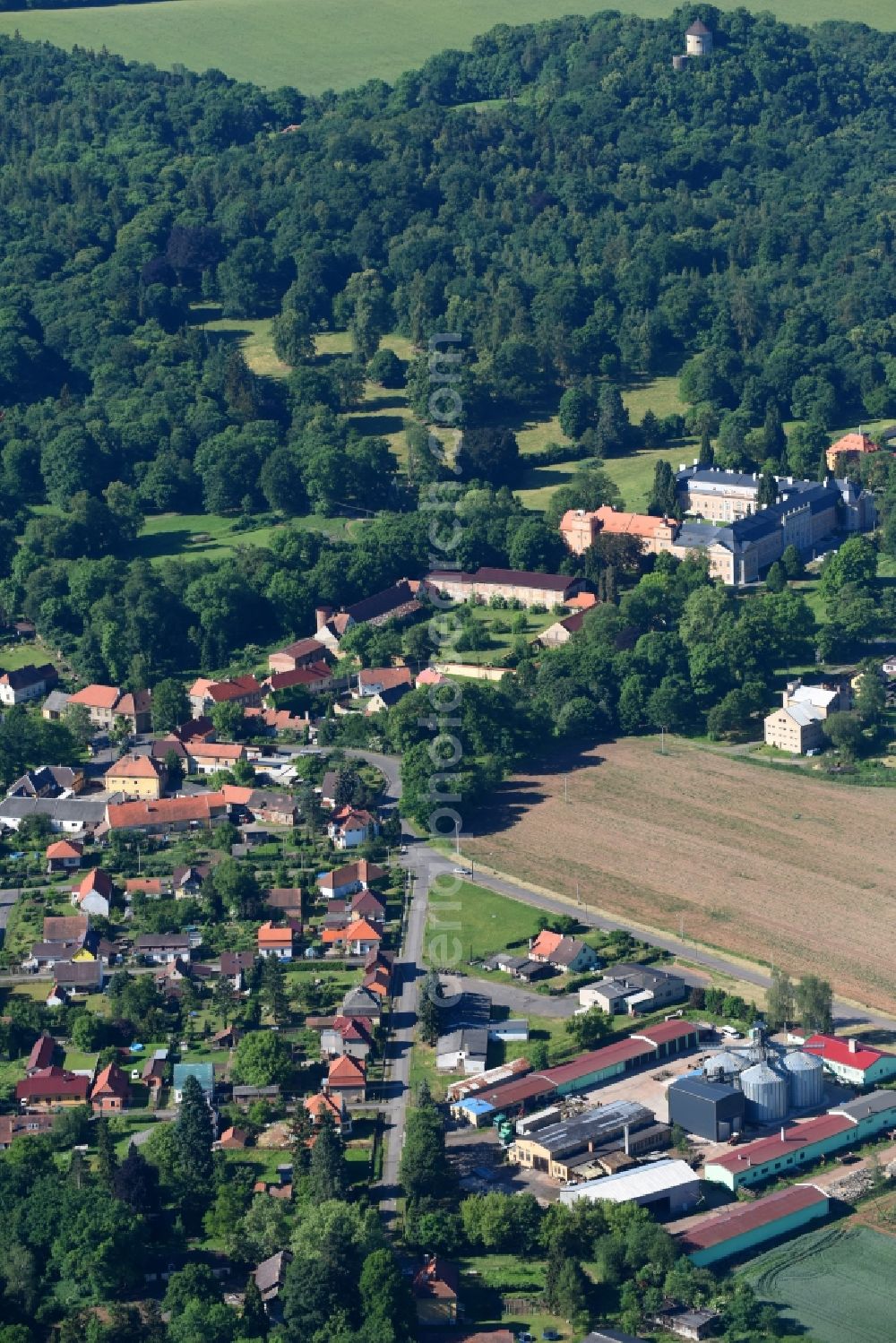 Aerial image Petrohrad - Petersburg - Village - view on the edge of agricultural fields and farmland in Petrohrad - Petersburg in Ustecky kraj - Aussiger Region, Czech Republic