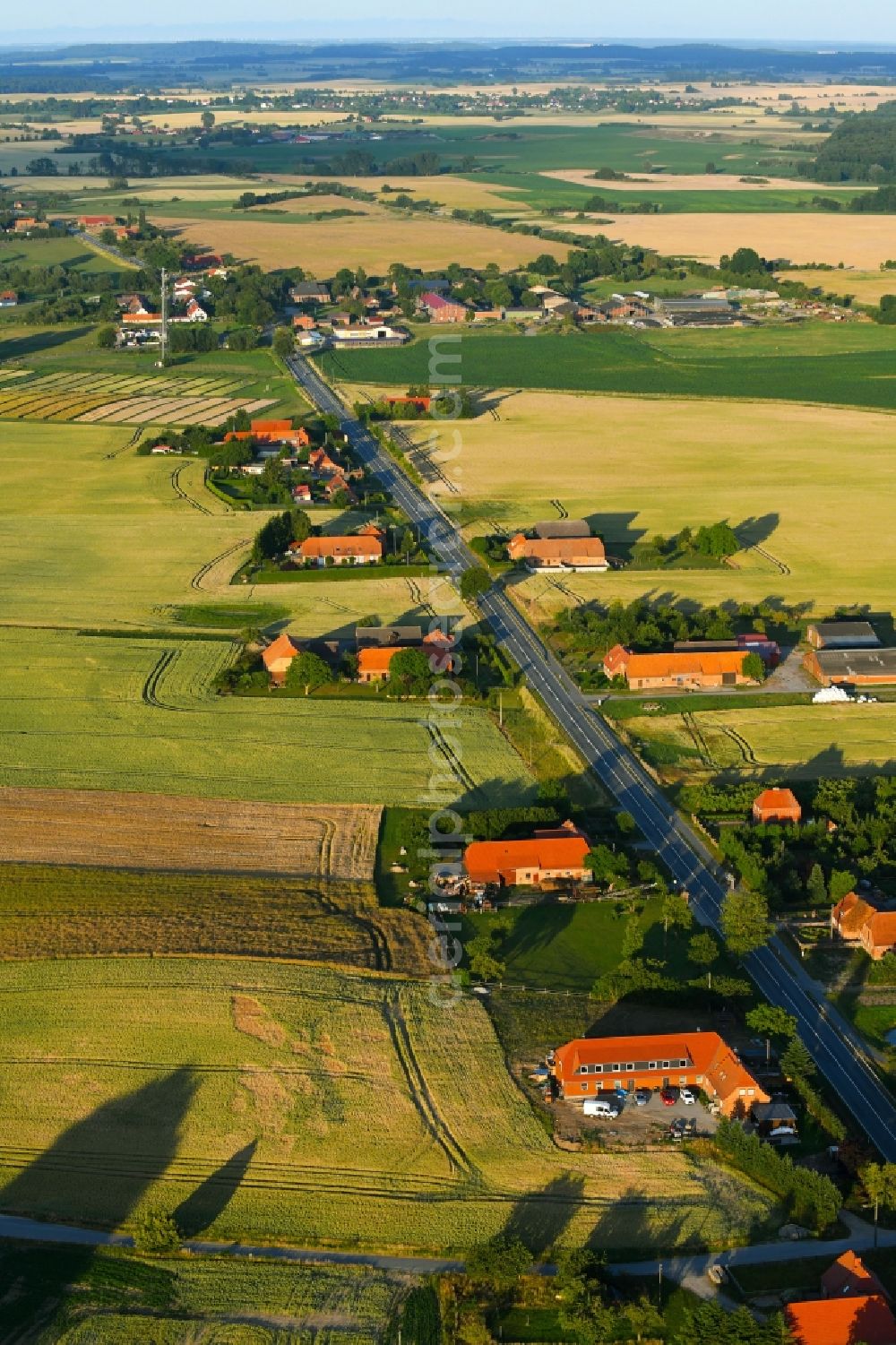 Raden from the bird's eye view: Village - view on the edge of agricultural fields and farmland in Raden in the state Mecklenburg - Western Pomerania, Germany