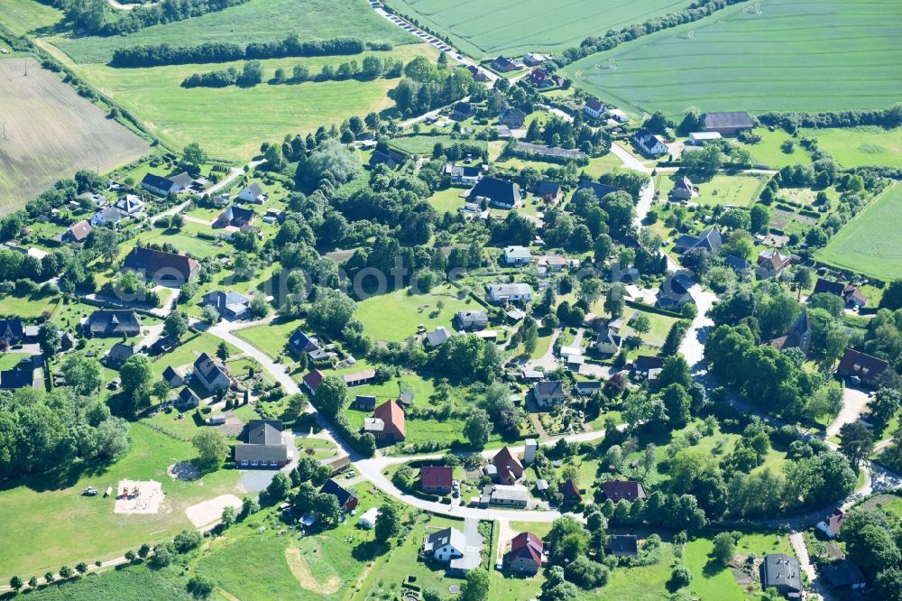 Roggenstorf from above - Village - view on the edge of agricultural fields and farmland in Roggenstorf in the state Mecklenburg - Western Pomerania, Germany