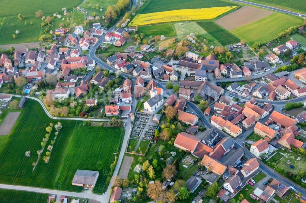 Schallfeld from above - Village - view on the edge of agricultural fields and farmland in Schallfeld in the state Bavaria, Germany