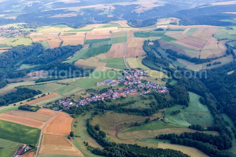 Aerial image Schauerberg - Village - view on the edge of agricultural fields and farmland in Schauerberg in the state Rhineland-Palatinate, Germany